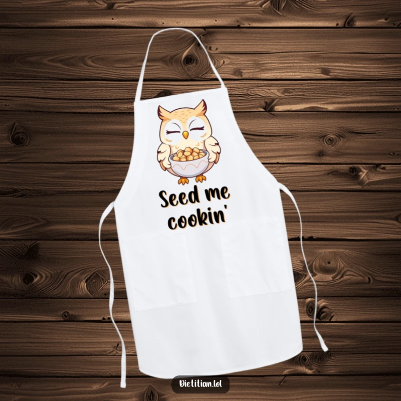 Funny owl apron showing a winking owl offering seeds, ideal for kitchen fun with wise and generous flair.