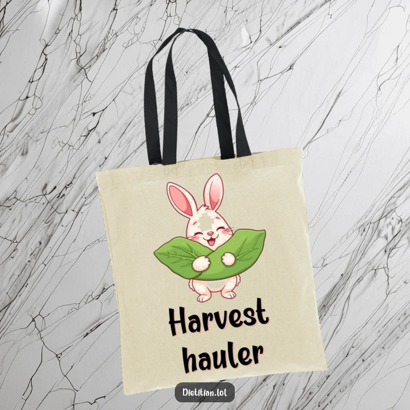 Funny Tote Bag with a cheerful rabbit beaming while holding a giant leafy green, perfect for everyday use.